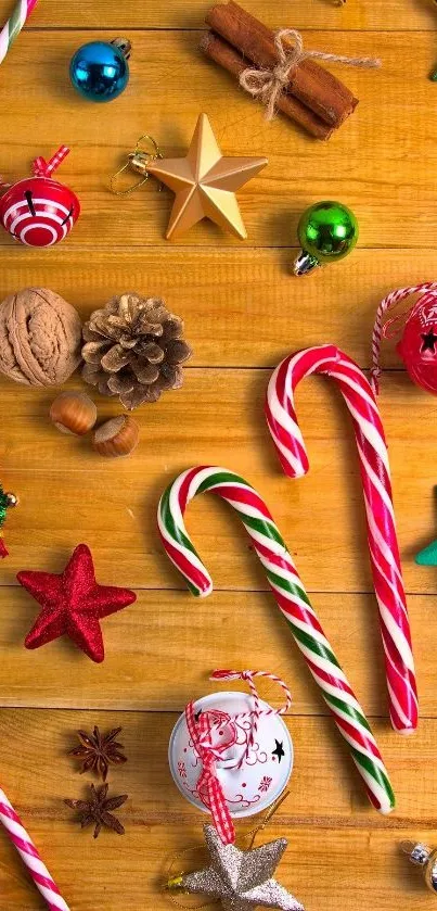 Festive holiday wallpaper with candy canes and decorations on wooden surface.