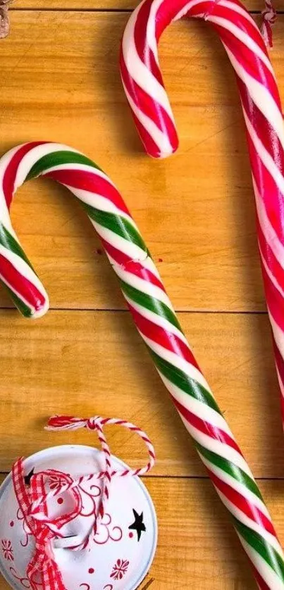 Festive candy cane wallpaper on wooden background.