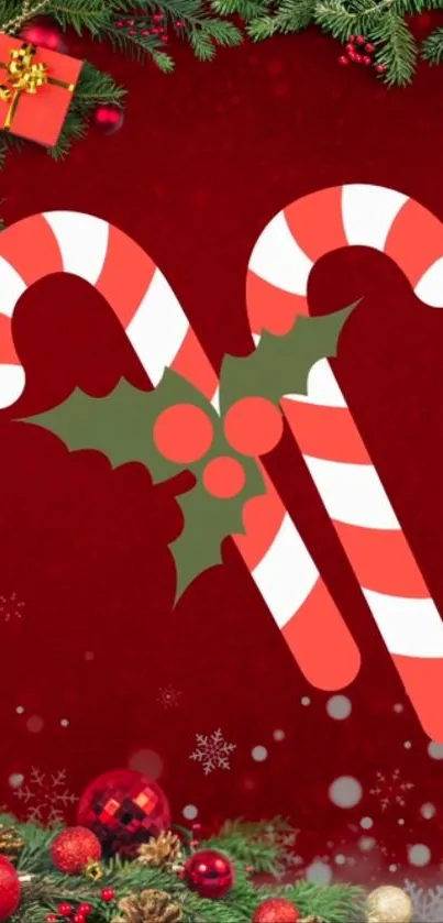 Red festive wallpaper with candy canes and holly leaves.