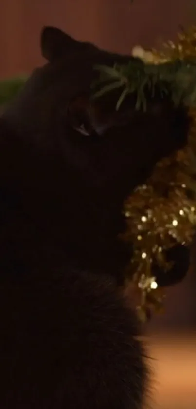 A black cat exploring festive holiday decorations with golden garland.