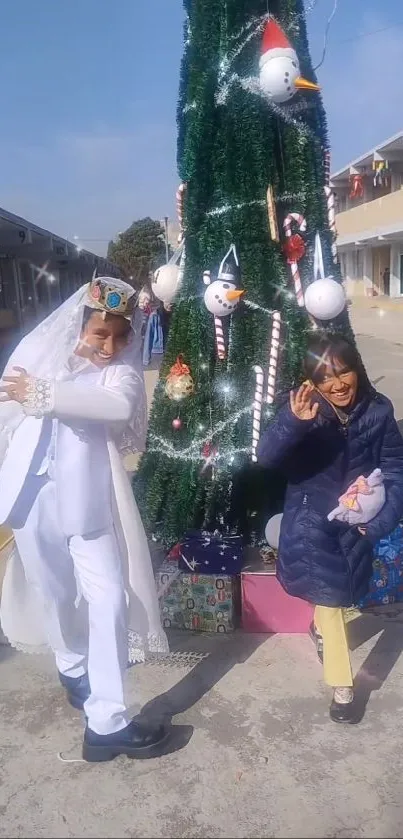 Festive scene with Christmas tree and people celebrating outdoors.