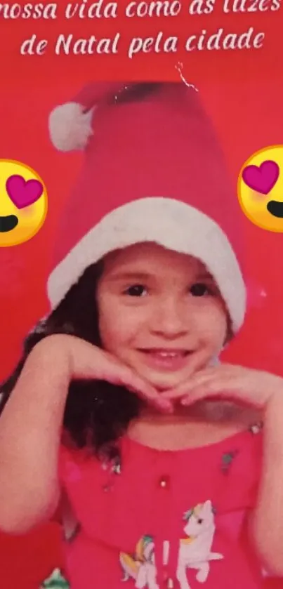 Child in Santa hat with festive background and emojis.