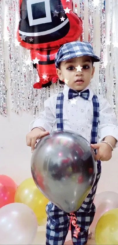 Child in festive outfit holding a colorful balloon.