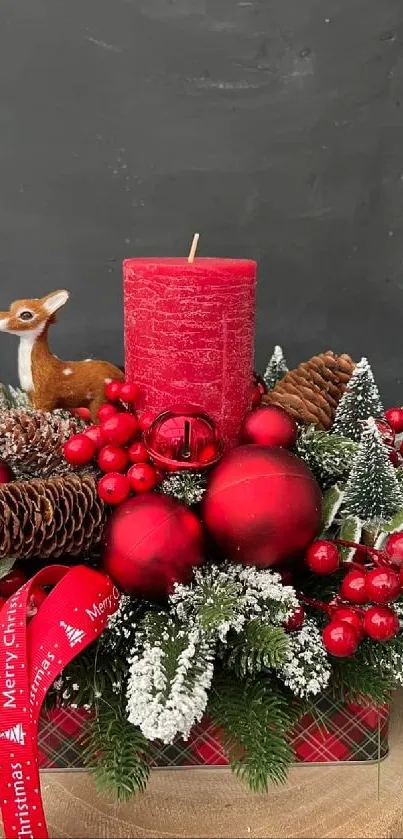 Christmas centerpiece with red candle and ornaments on wood.