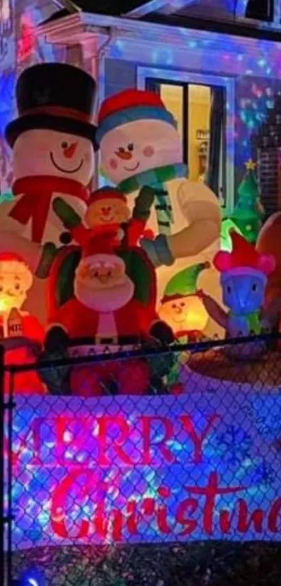 Festive Christmas display with snowmen and Santa.