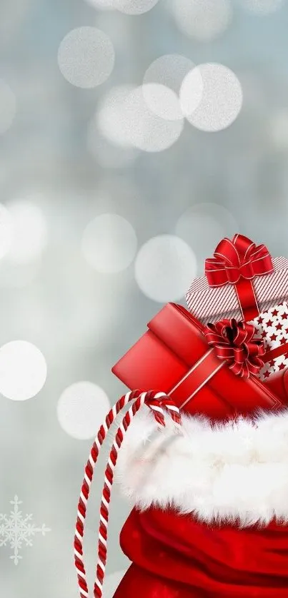 Red Christmas gifts in Santa sack against a soft wintery bokeh background.