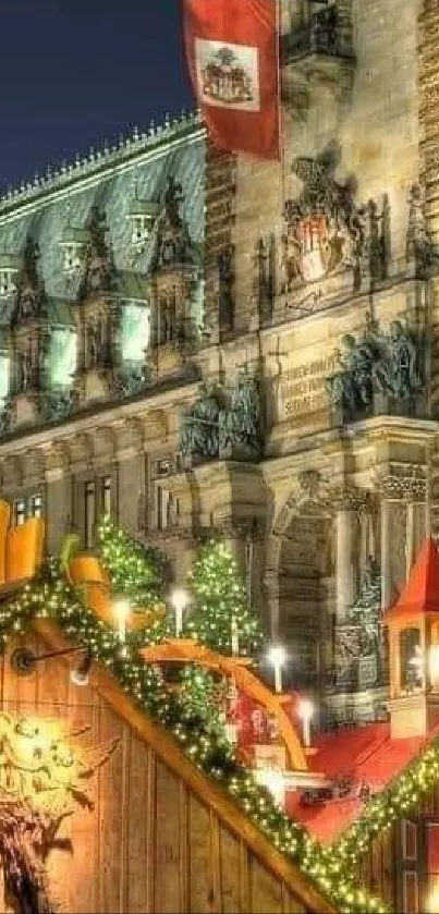 Festive Christmas market with lights in front of a historic building at night.