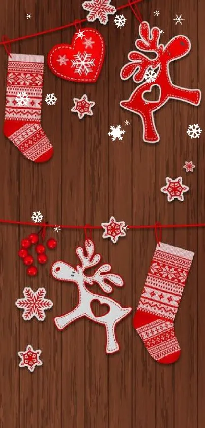 Festive red and white Christmas decorations on wooden background.