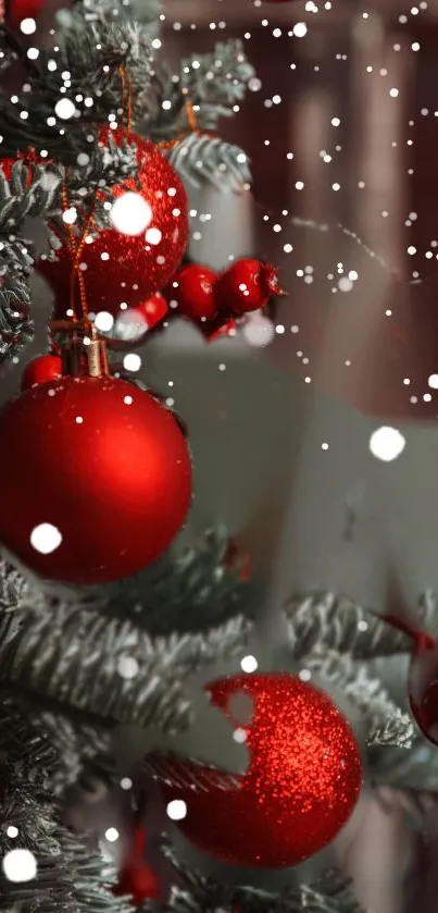 Close-up of Christmas tree with red ornaments and falling snowflakes.