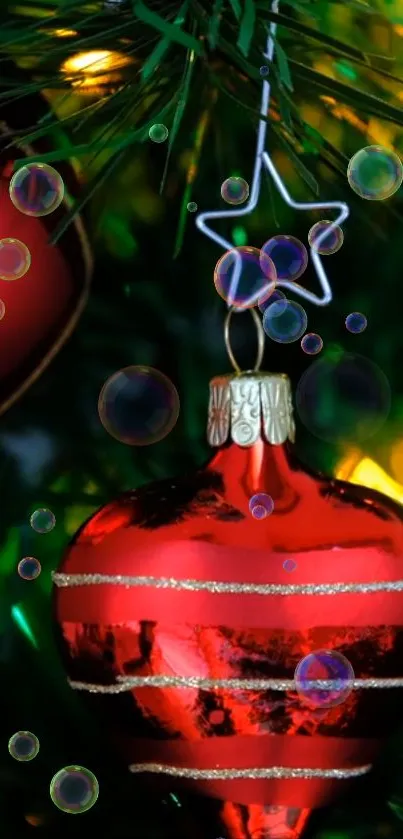 Red Christmas ornament on tree with bubbles and festive lights.