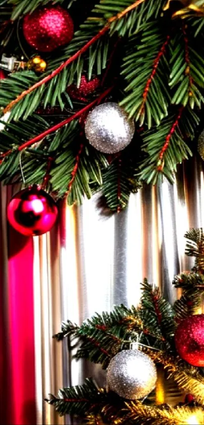 Festive Christmas wallpaper with ornaments and green branches.