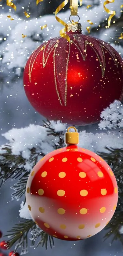 Red Christmas ornaments on snow-covered tree with gold accents.