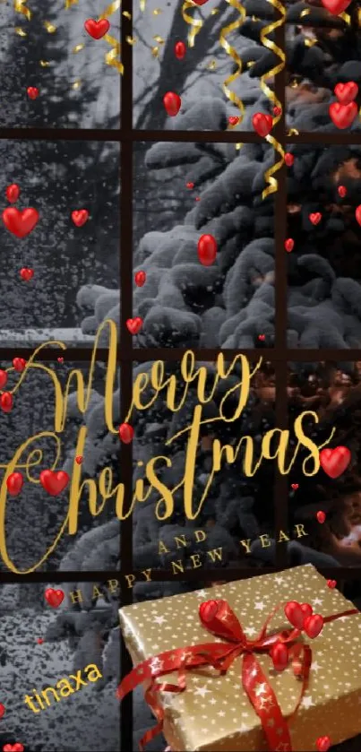 Merry Christmas wallpaper with snow, gold text, and a gift box.