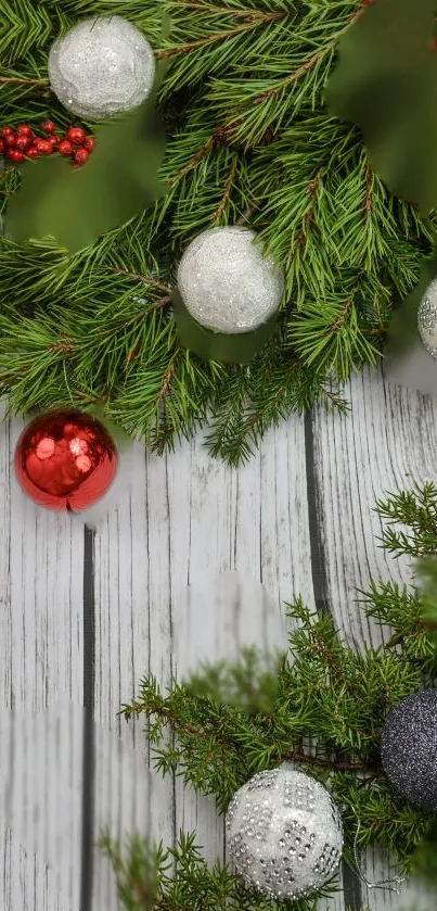 Festive Christmas wallpaper with pine branches and ornaments.