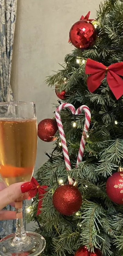 Christmas tree with red ornaments and champagne glass.