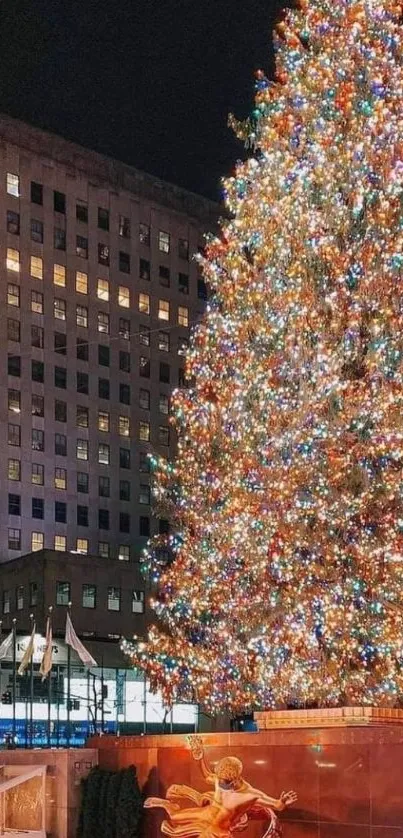 Festive Christmas tree with lights in city square at night.