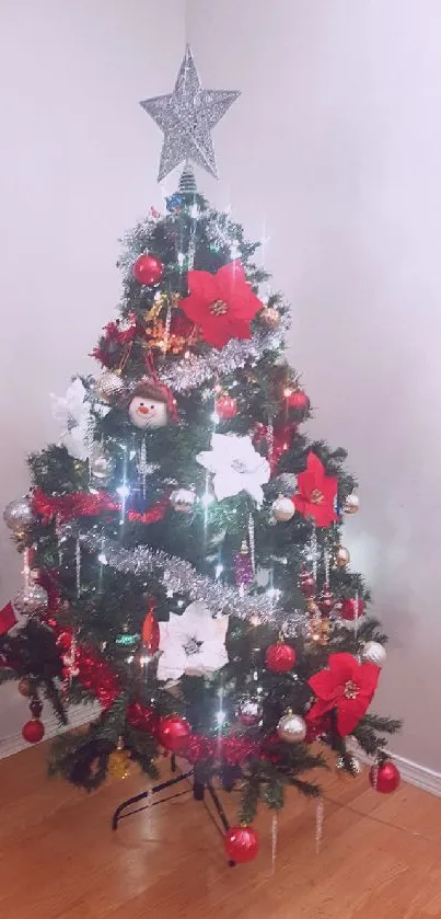 Festive Christmas tree with star topper and colorful decorations.