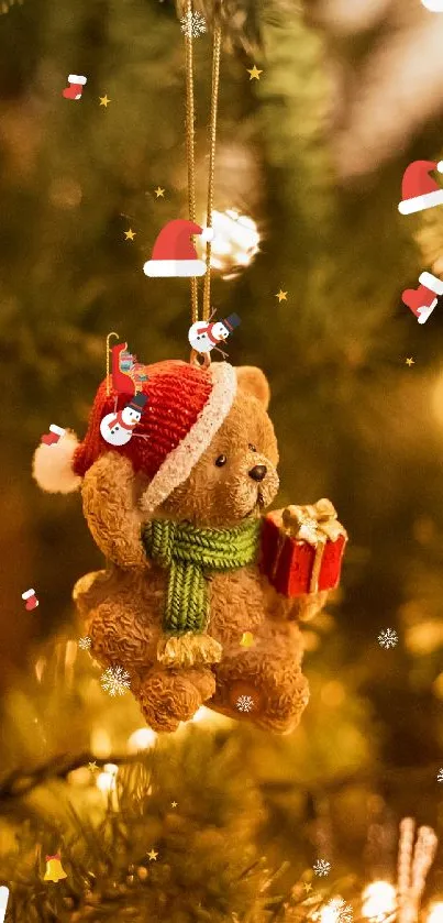 Teddy bear Christmas ornament on pine branches.