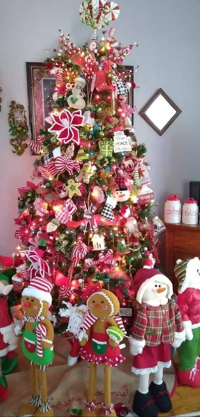 Vibrant Christmas tree with holiday figures and red decorations.