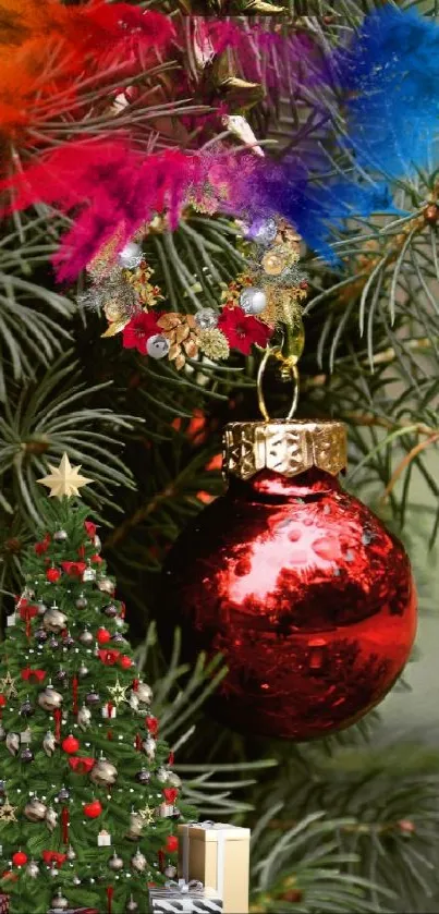 Christmas tree with red ornament and vibrant feathers.