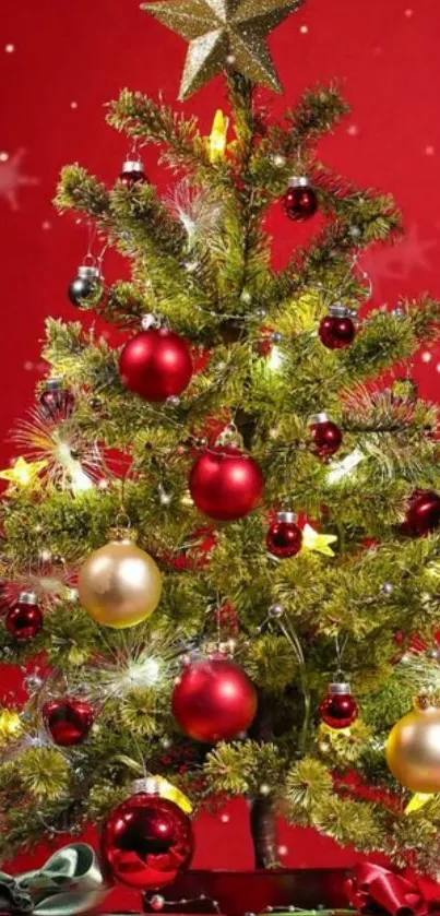 Festive Christmas tree with red and gold ornaments on vibrant red background.