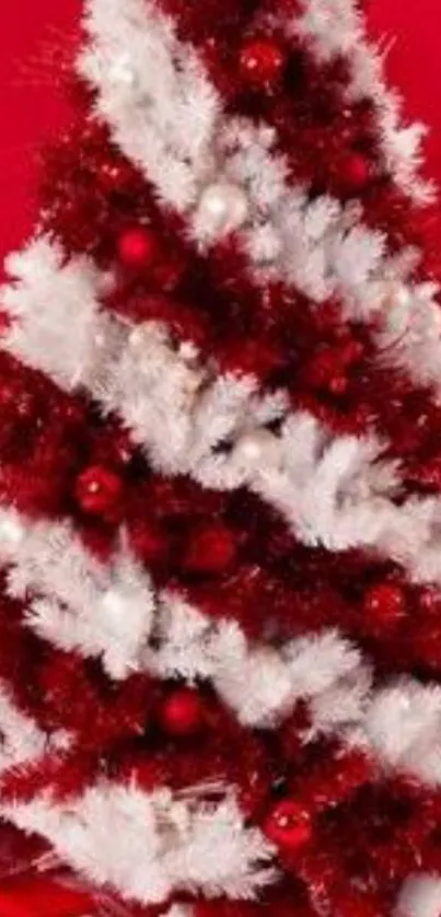 Christmas tree in red and white with gifts beneath.