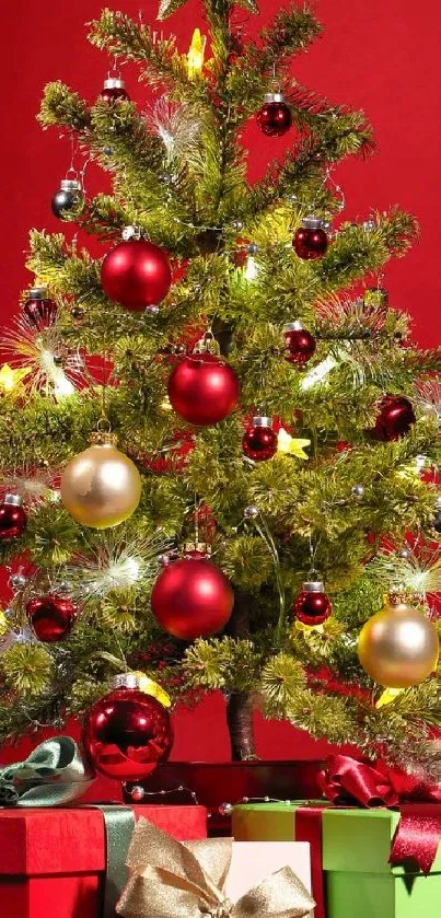 Vibrant Christmas tree with red ornaments and gift boxes on a vivid red backdrop.