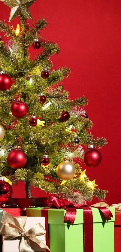 Colorful Christmas tree with gifts against a red background, featuring red and gold ornaments.