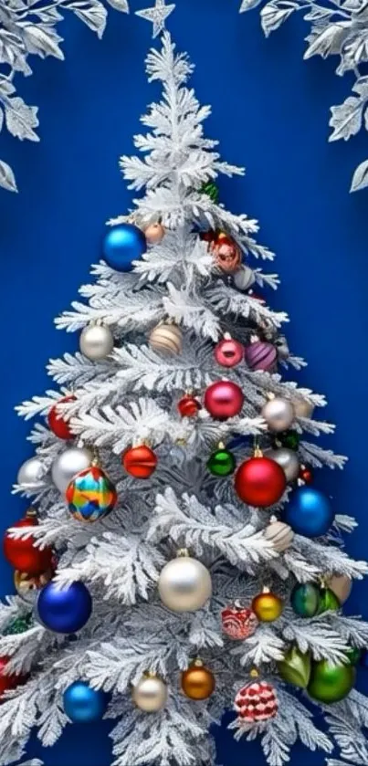 White Christmas tree with colorful ornaments on blue background.