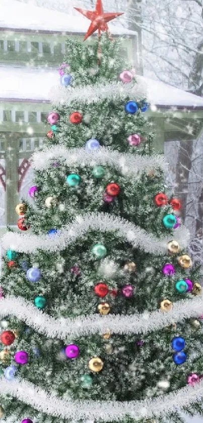 A Christmas tree adorned with ornaments and surrounded by snow.