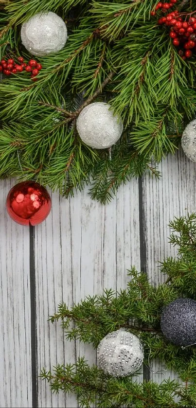 Festive Christmas wallpaper with pine branches and colorful ornaments.