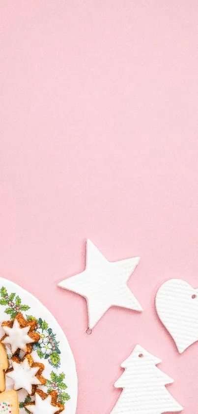 Festive pink wallpaper with cookies and white decorations.