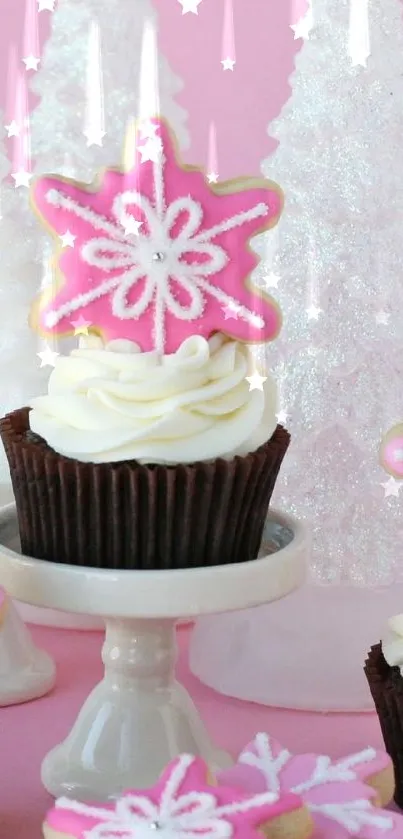 Pink cupcake with snowflake cookie on winter decor.