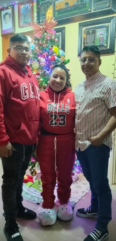 Family gathered by a festive Christmas tree, exuding warmth and holiday spirit.