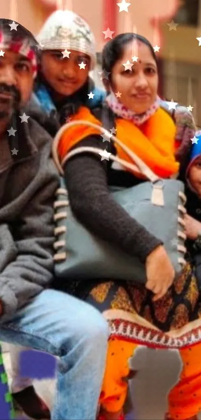 Family sitting together in festive attire with star effects around them.