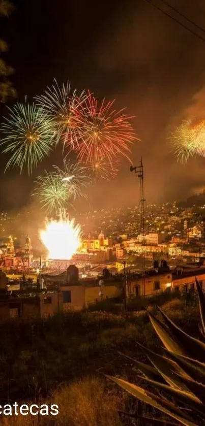 Vibrant fireworks over Zacatecas cityscape at night.