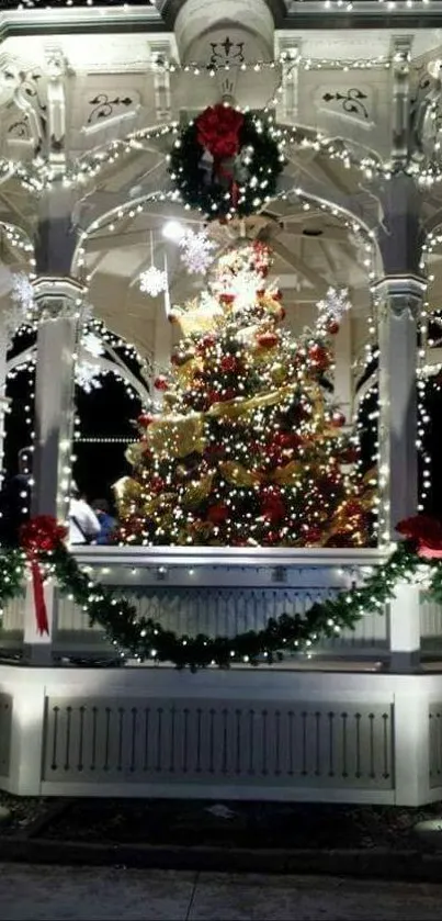 Festive gazebo with Christmas lights and decorations at night.