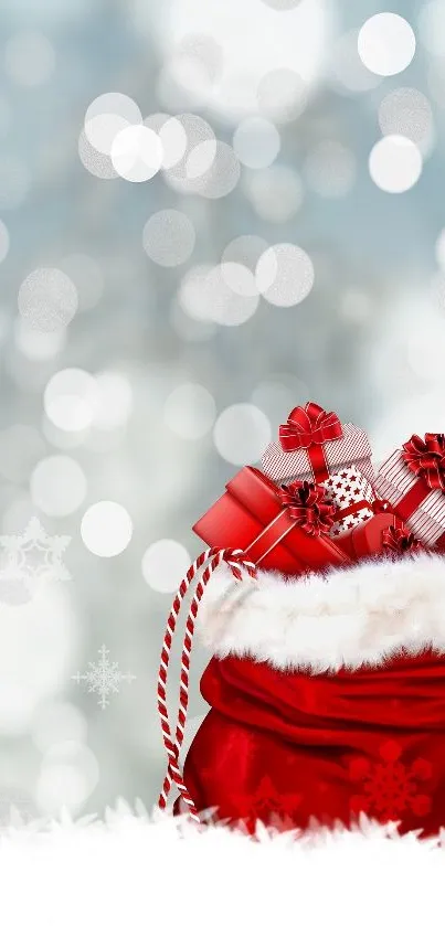 Mobile wallpaper of a red Santa's bag filled with gifts on a snowy background.