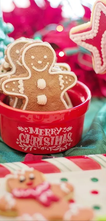 Festive gingerbread cookies in a Christmas-themed red bowl with holiday decor.