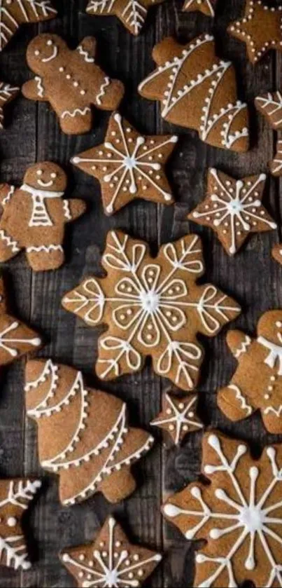 Mobile wallpaper with gingerbread cookies on dark wood.