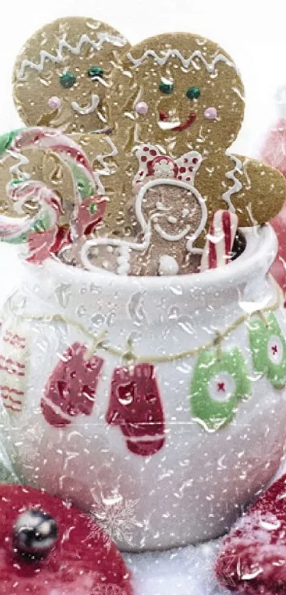 Festive gingerbread cookies and candy in a snow-covered jar.