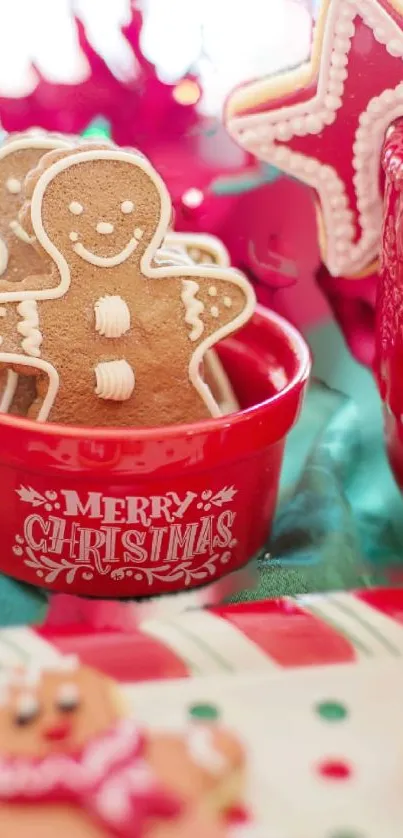 Cheerful gingerbread cookies in a red bowl with festive Christmas decorations.