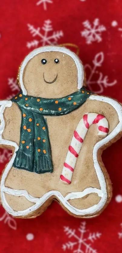 Gingerbread man with scarf on festive red background.