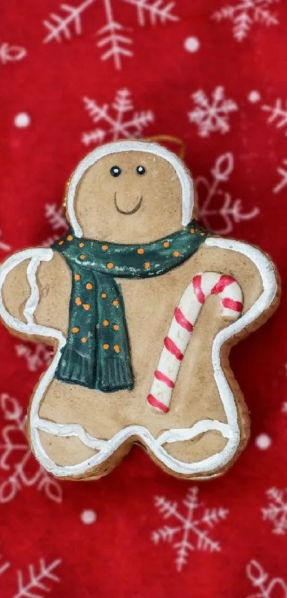 Gingerbread man on red snowflake background for mobile wallpaper.