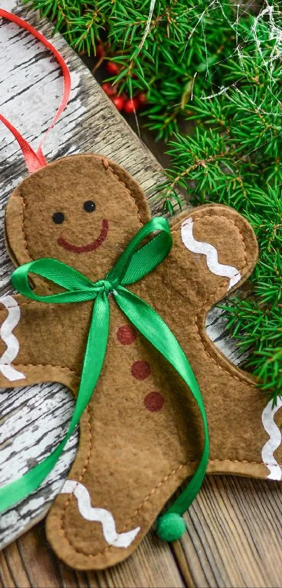 Gingerbread man ornament on rustic wood with green ribbon.