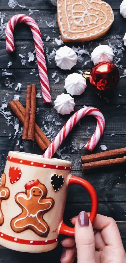 Festive phone wallpaper with gingerbread mug and holiday treats.