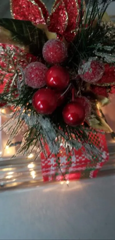 Festive glass gift box with red decorations and lights.