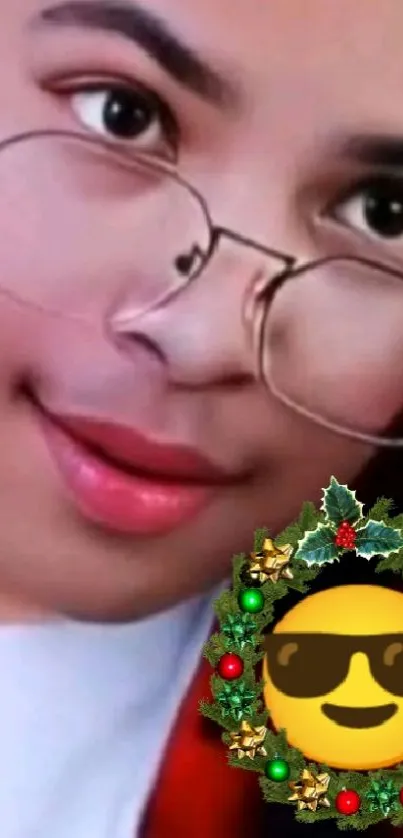 Close-up of person with glasses and festive emoji.