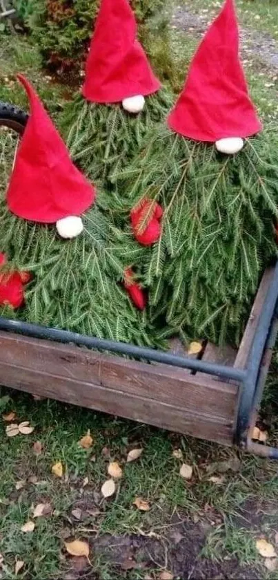 Mobile wallpaper featuring gnomes with red hats in a wooden cart.