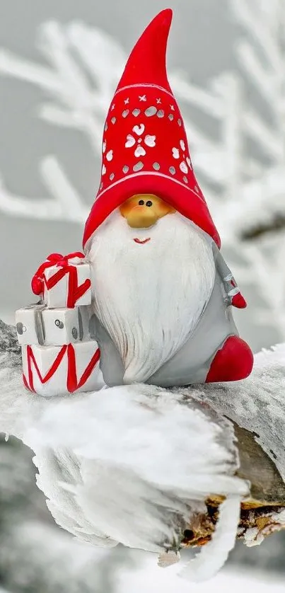 Festive gnome on snowy branch with winter backdrop.